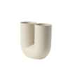 The Kink Vase brings a contemporary form to the archetypal flower vase through a combination of traditional craftsmanship and playful design language. With its double opening, the Kink Vase adds a sculptural sentiment to the room, even when not in use. The design is made in porcelain that has been glazed on the inside for a refined touch.