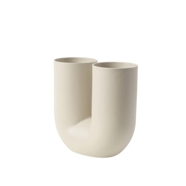 The Kink Vase brings a contemporary form to the archetypal flower vase through a combination of traditional craftsmanship and playful design language. With its double opening, the Kink Vase adds a sculptural sentiment to the room, even when not in use. The design is made in porcelain that has been glazed on the inside for a refined touch.